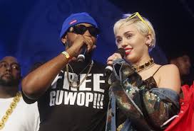 Miley Cyrus, right, joins Mike Will Made It onstage at the Fader Fort Presented by Converse