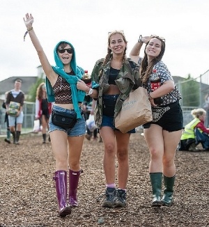 festival goers and hunter wellingtons